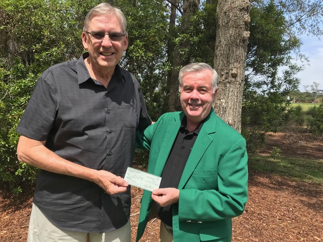 South Carolina Ancient Order of Hibernians raffle chairman, Tim O’Connor presents the third prize check for $500 to Bill Wiemels of Bluffton.